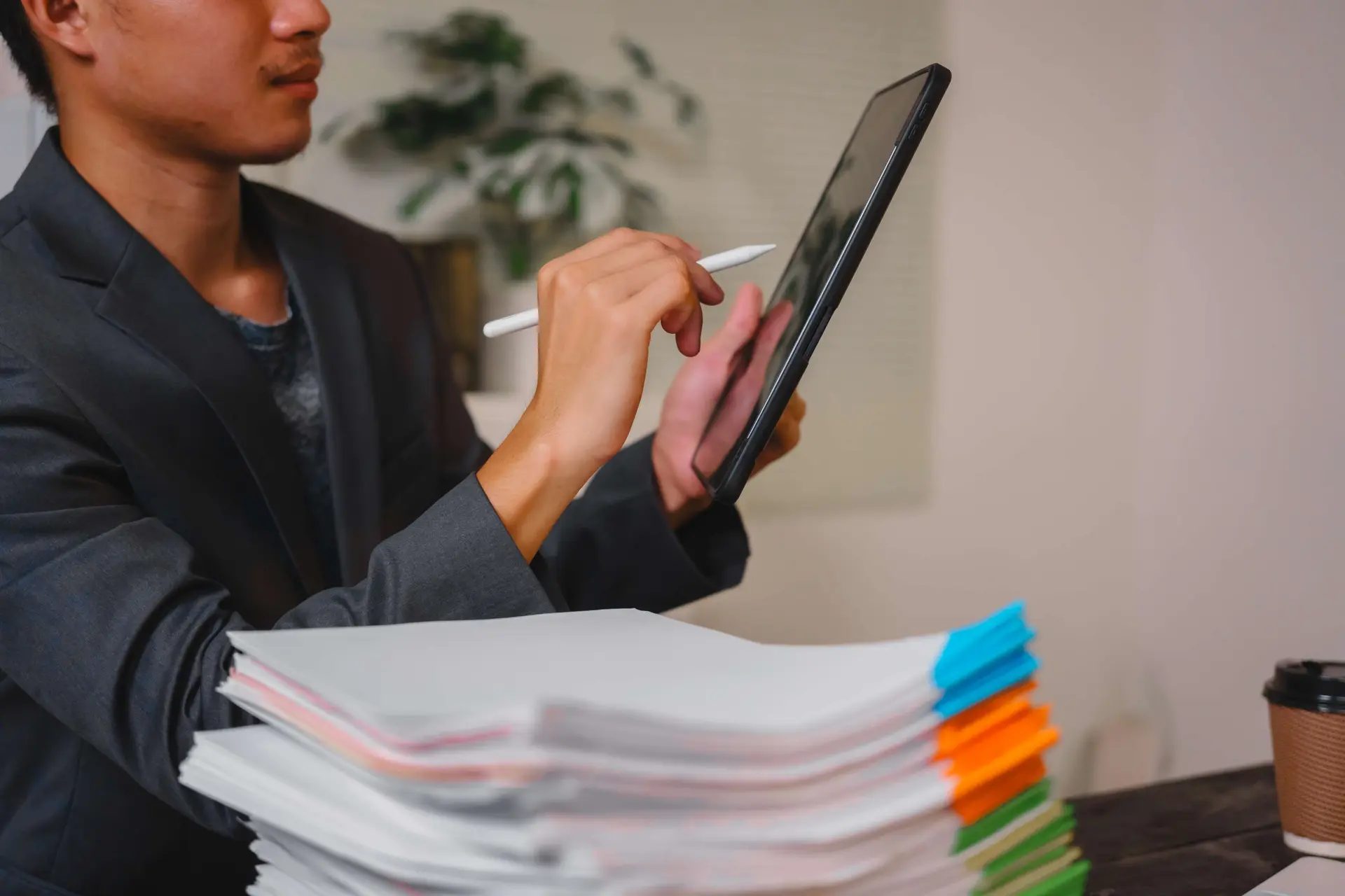 Professional digitizing paper documents with tablet for paperless Business Central workflow and document management, Dynamics Monk.